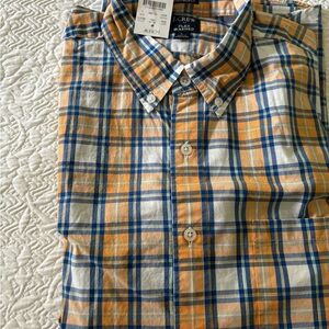 This is a new J Crew slim untucked flex washed button down shirt.